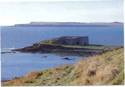 The Boddin limekiln in the 1990's with all its walls intact. There is a net drying green to the right of the structure and in the background is Lunan Bay and the Red Head of Angus headland to its south